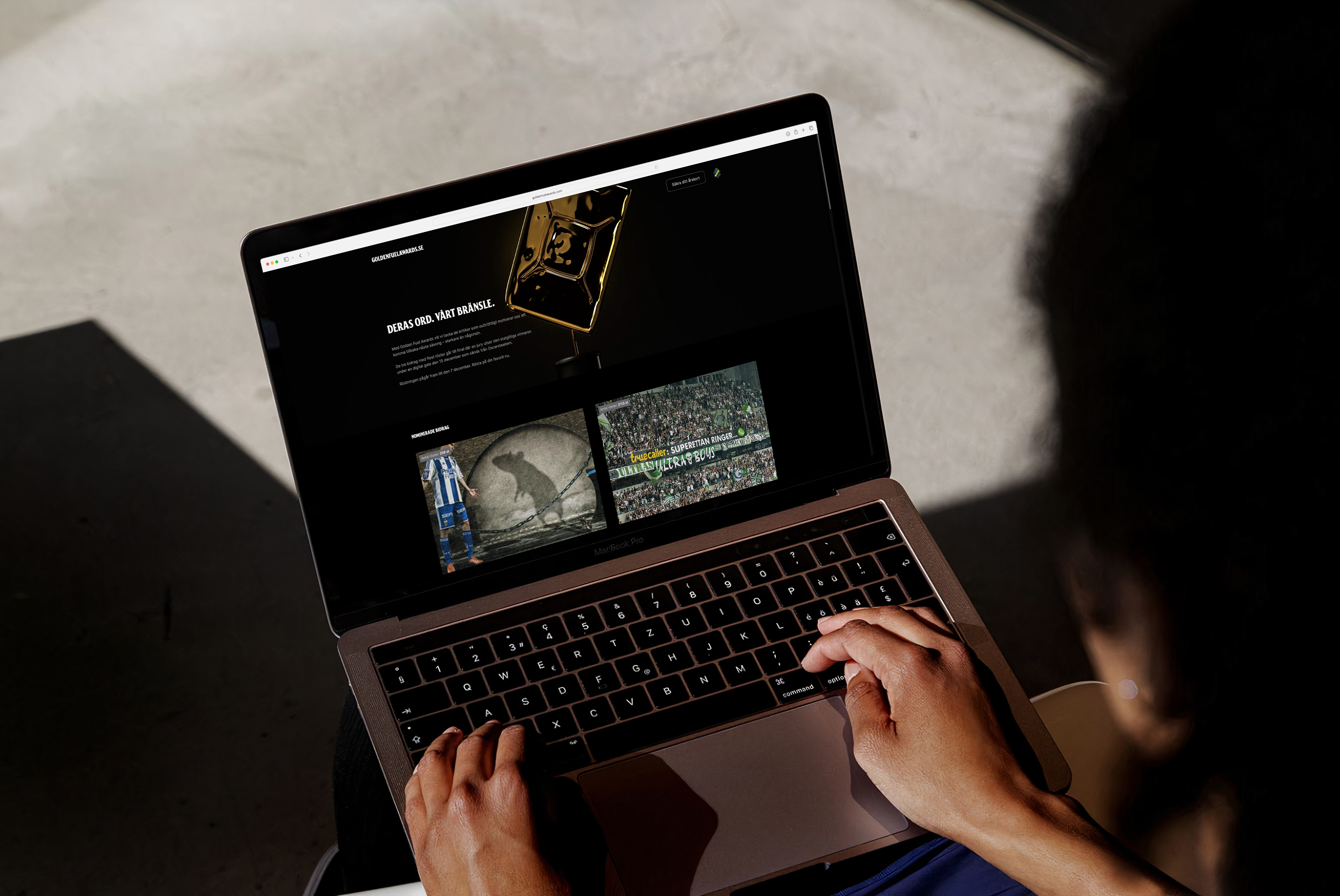 A laptop with the Golden Fuel Awards website.