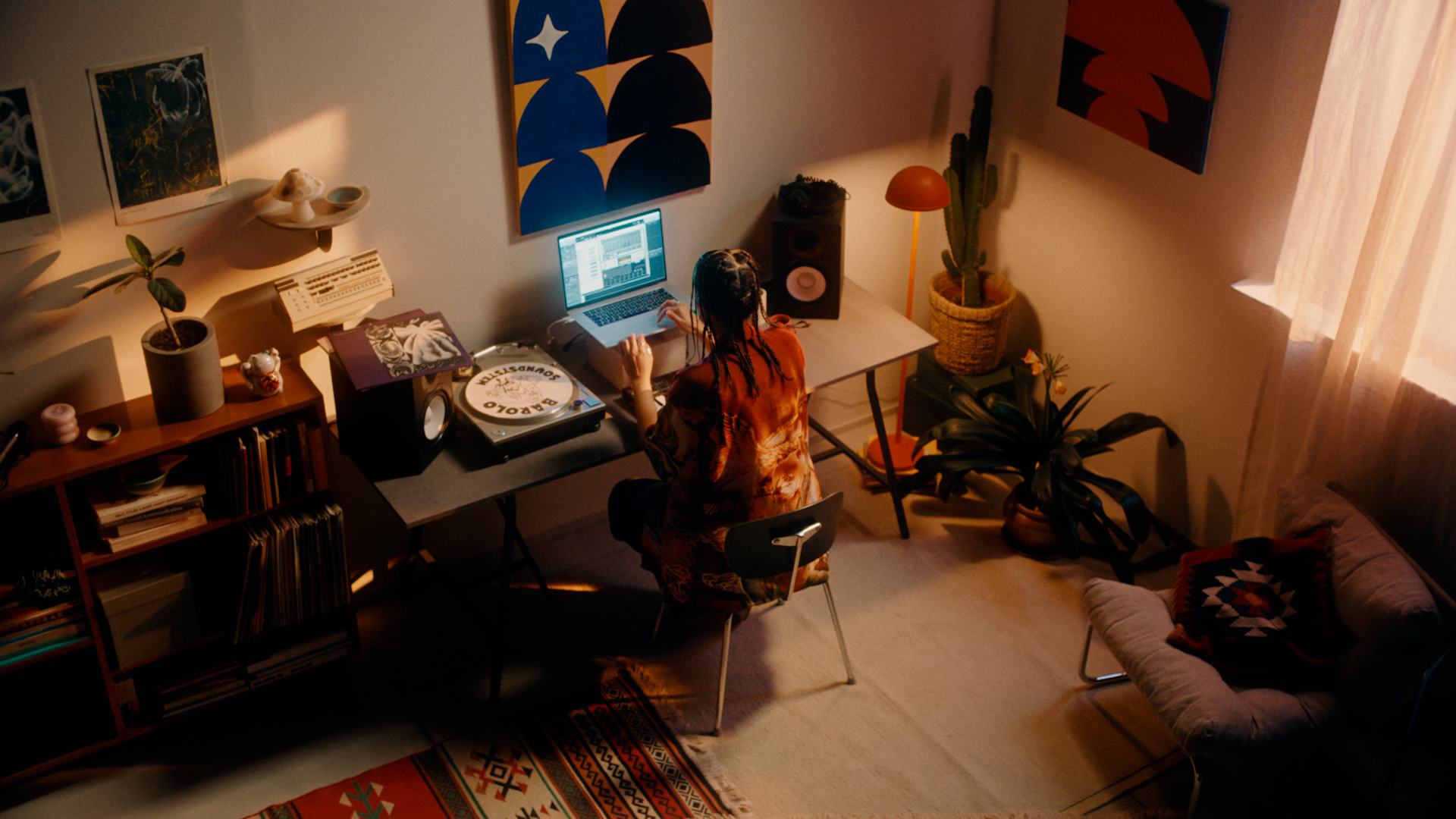 A woman sitting in front of a laptop.