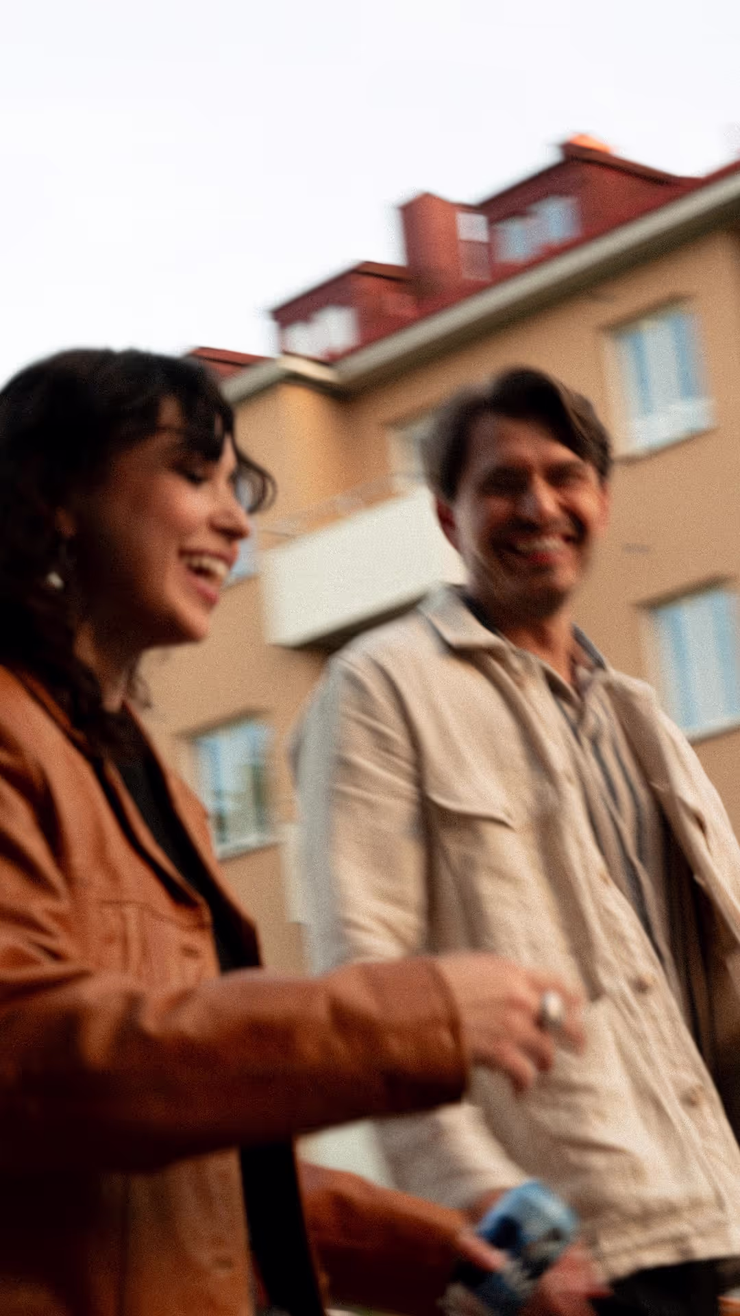 A woman and a man laughing together